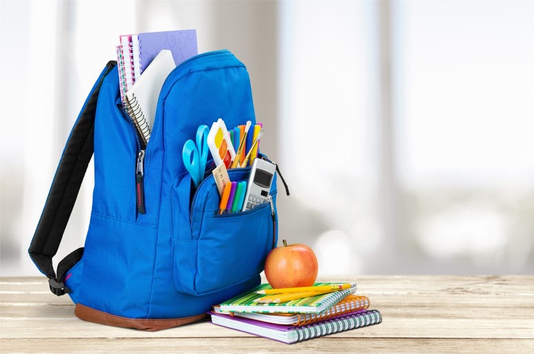 Photo of a backpack at school. Photo of a backpack at school.