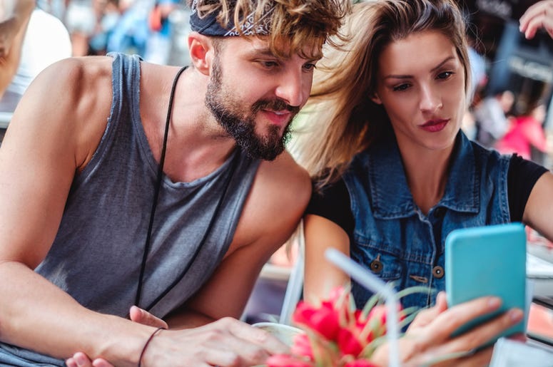 couple looking at phone couple looking at phone