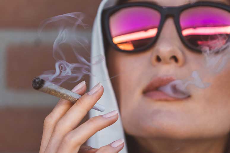 woman smoking marijuana joint
