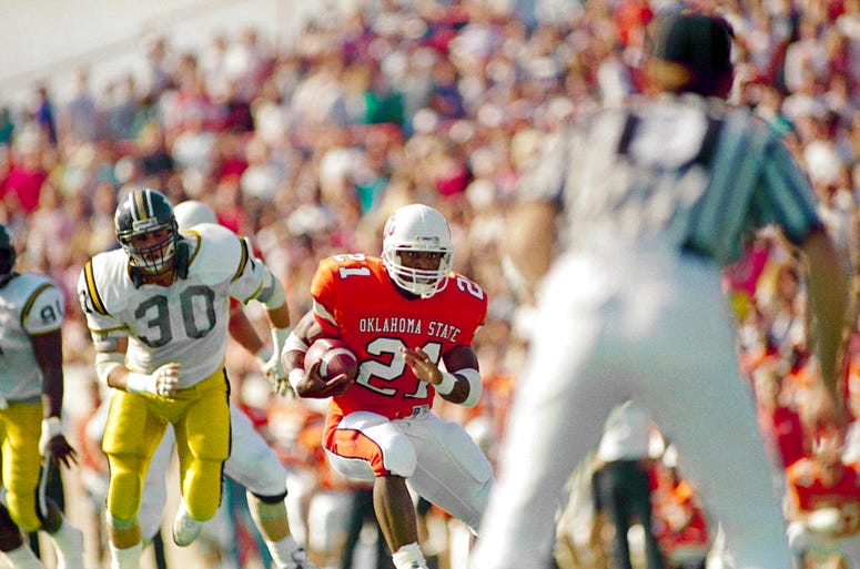 Oklahoma State tailback Barry Sanders (21) cuts past Missouri defender Ron Waiters (30) for a short gain during the first quarter of a college football game in Stillwater, Okla.