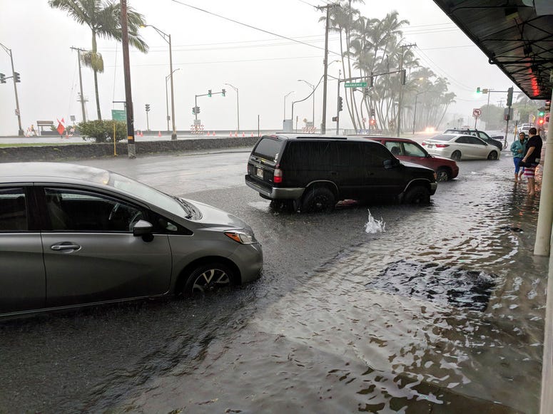 Hawaii officials say it's too early to quantify the extent of damage from Tropical Storm Lane, which flooded homes and businesses and washed out roads.