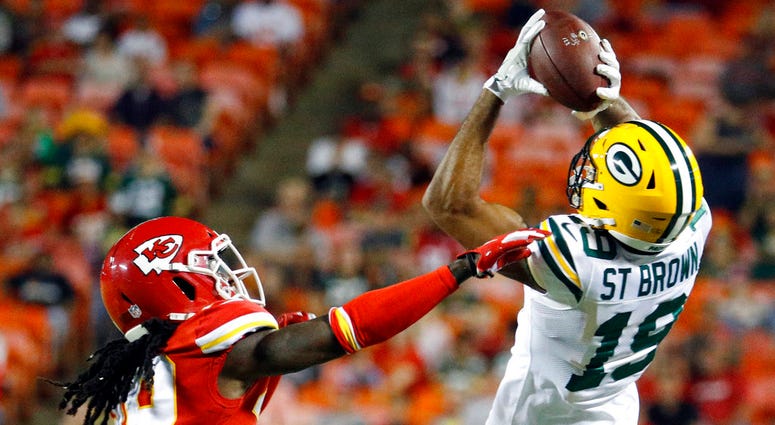 Green Bay Packers wide receiver Equanimeous St. Brown (19) makes a catch over Kansas City Chiefs cornerback Tremon Smith (39)