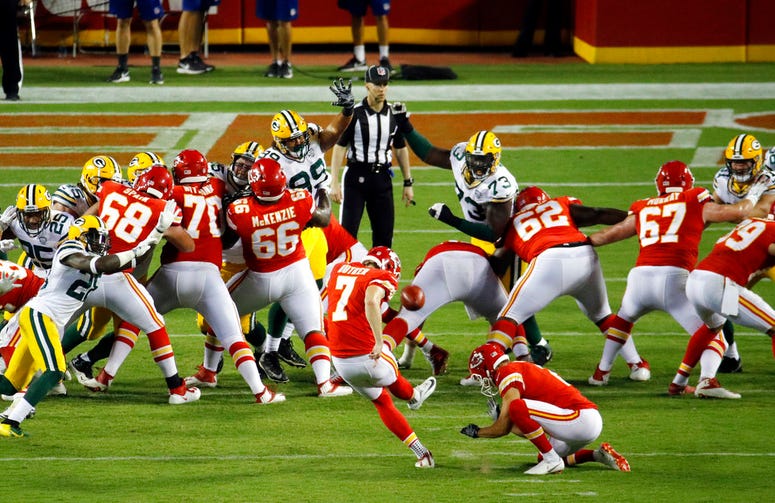 Kansas City Chiefs' Harrison Butker (7) kicks an extra point during the second half of an NFL preseason football game against the Green Bay Packers in Kansas City, Mo.