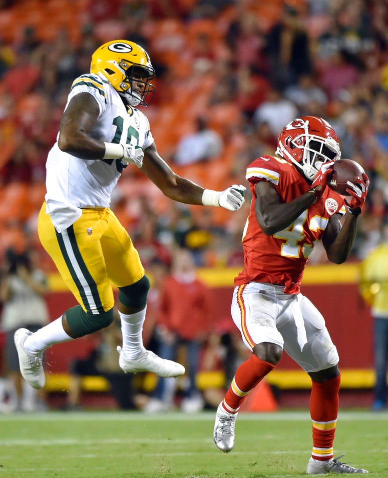 Kansas City Chiefs cornerback Makinton Dorleant (43) intercepts a pass intended for Green Bay Packers wide receiver DeAngelo Yancey (10) and runs for a touchdown