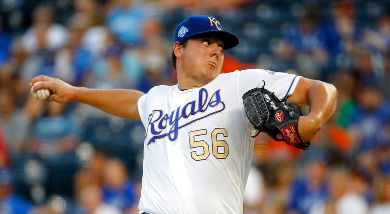Kansas City Royals starting pitcher Brad Keller throws during the first inning of the team's baseball game against the Baltimore Orioles
