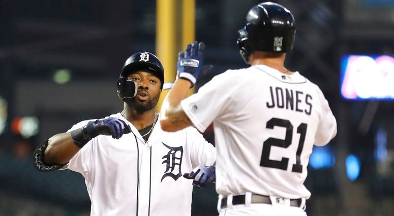 Detroit Tigers' Christin Stewart, left, is greeted by JaCoby Jones at home plate after both scored on Stewart's two-run home run during the first inning