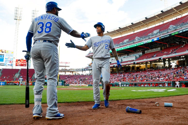 Kansas City Royals' Adalberto Mondesi (27) celebrates with Jorge Bonifacio (38) after scoring on a double by Salvador Perez off Cincinnati Reds starting pitcher Cody Reed during the first inning