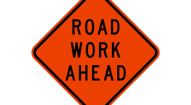 isolated road sign for road work