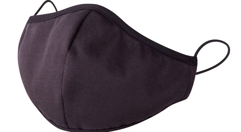Black fabric facial mask for health protection isolated on white background