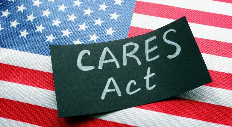 USA flag and word CARES act The Coronavirus Aid, Relief, and Economic Security Act