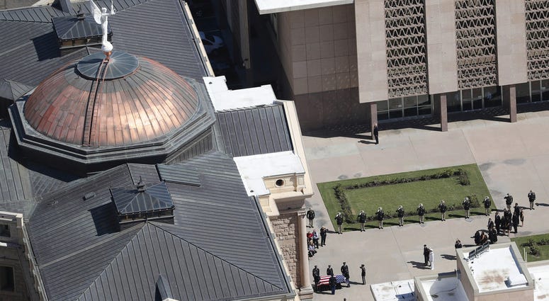 The Arizona National Guard escorts Sen. John McCain's casket to the Arizona State Capitol Rotunda in Phoenix, Ariz.