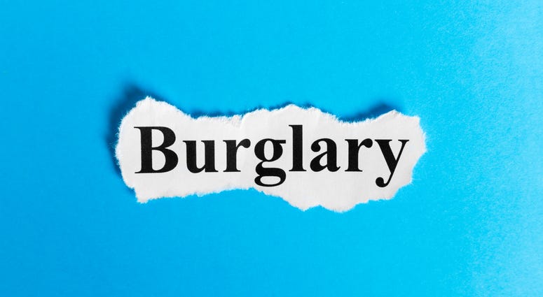 the word burglary on a blue background