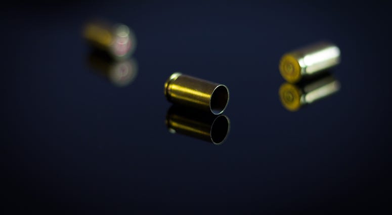 Casings of bullets on a glass table