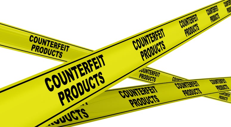 Yellow warning tapes with black text COUNTERFEIT PRODUCTS
