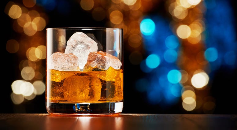 Glass of whiskey with ice