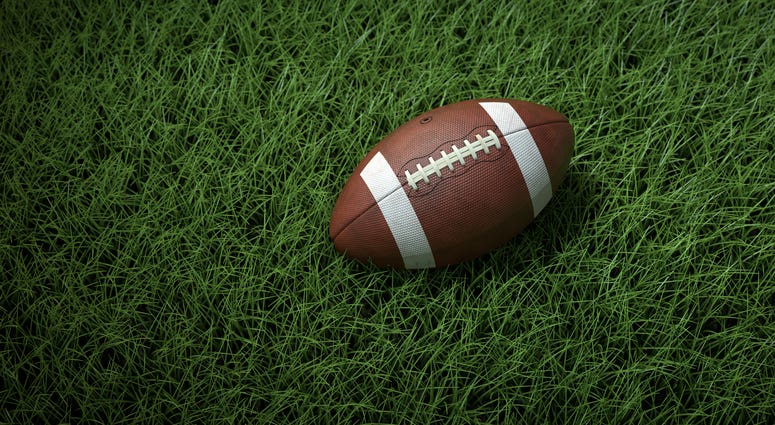 A close-up of a football on the field