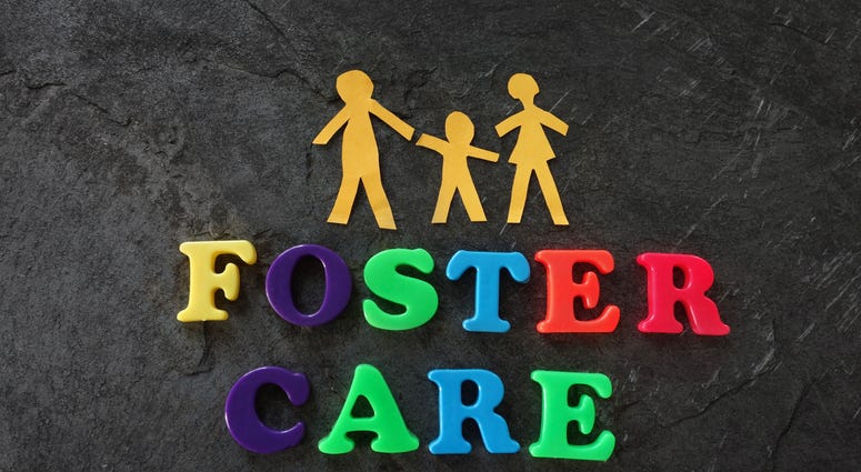 Paper family with foster care letters