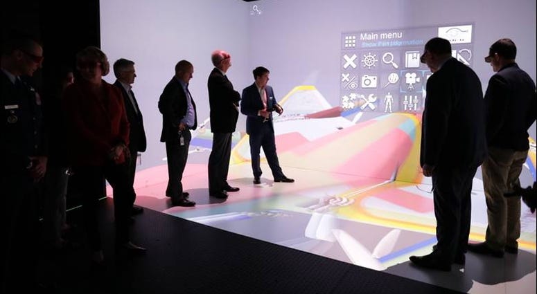 Sen. Moran, Under Secretary Donovan and Assistant Secretary Roper tour the 3-D Cave Automatic Virtual Environment (CAVE) in the Virtual Reality Lab at the Wichita State University Innovation Campus.