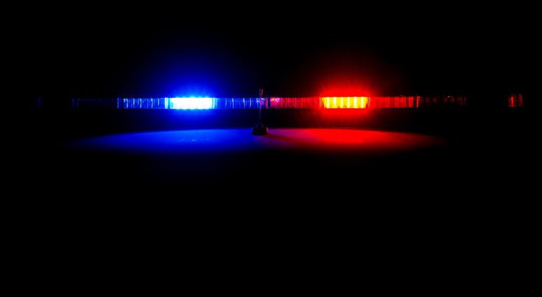 A police car at night with its emergency lights on