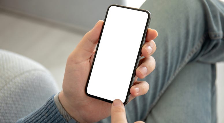 man holding phone with an isolated screen