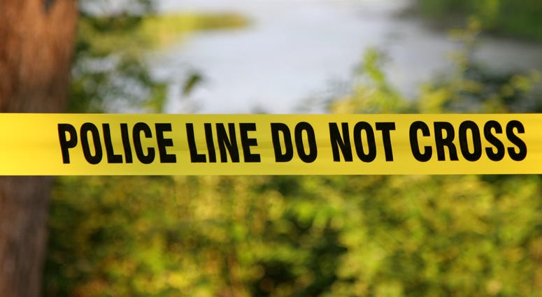 Police do not cross yellow plastic tape