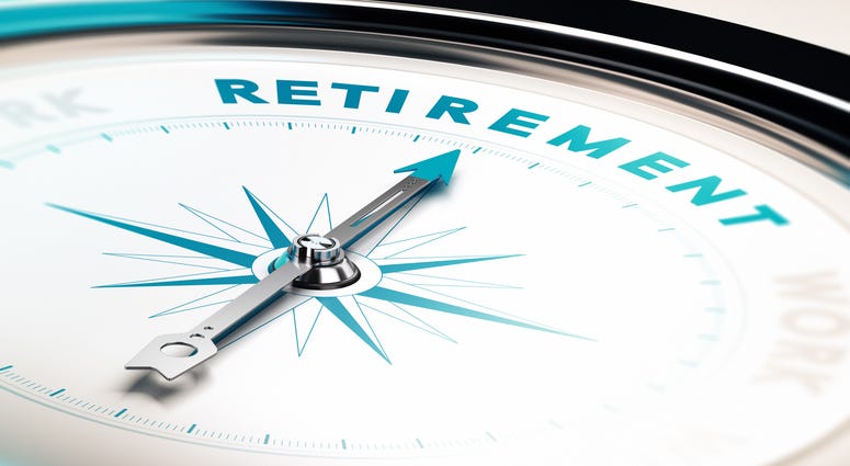 Compass with needle pointing the word retirement