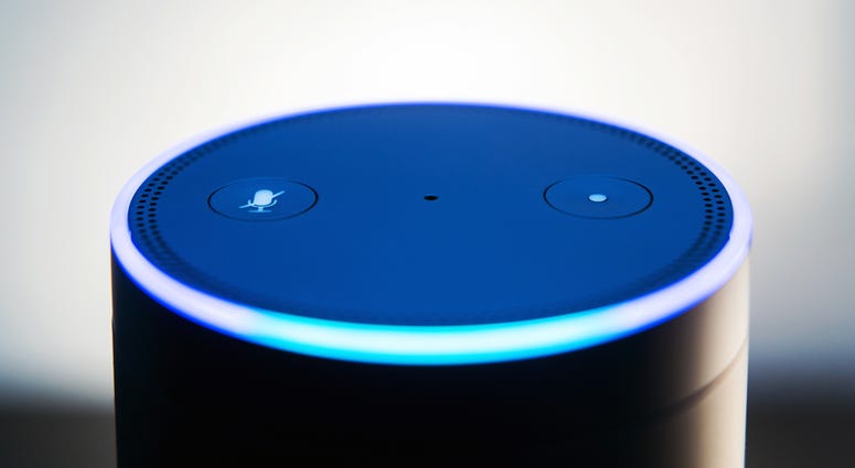 Amazon echo voice recognition system, selective focus and dark backdrop for impact of light ring Amazon echo voice recognition system, selective focus and dark backdrop for impact of light ring