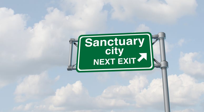 Sanctuary city concept and illegal immigration law government enforcement policies as a highway sign directing to welcoming immigrants with no legal status