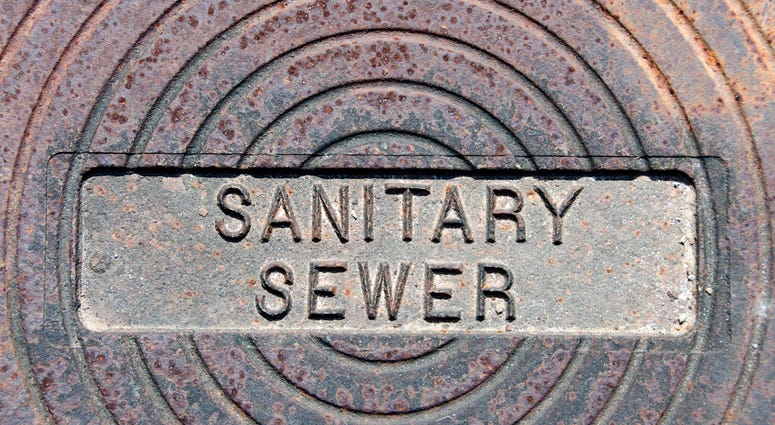 Sanitary Sewer imprinted on an iron cover for a sewer system