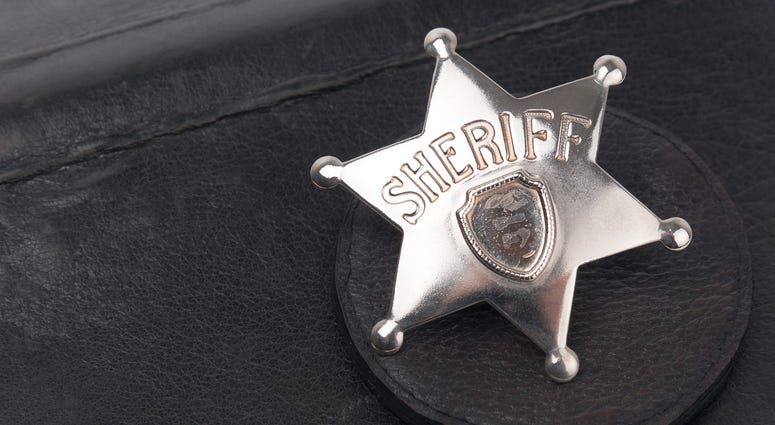 Sheriff's badge on dark background