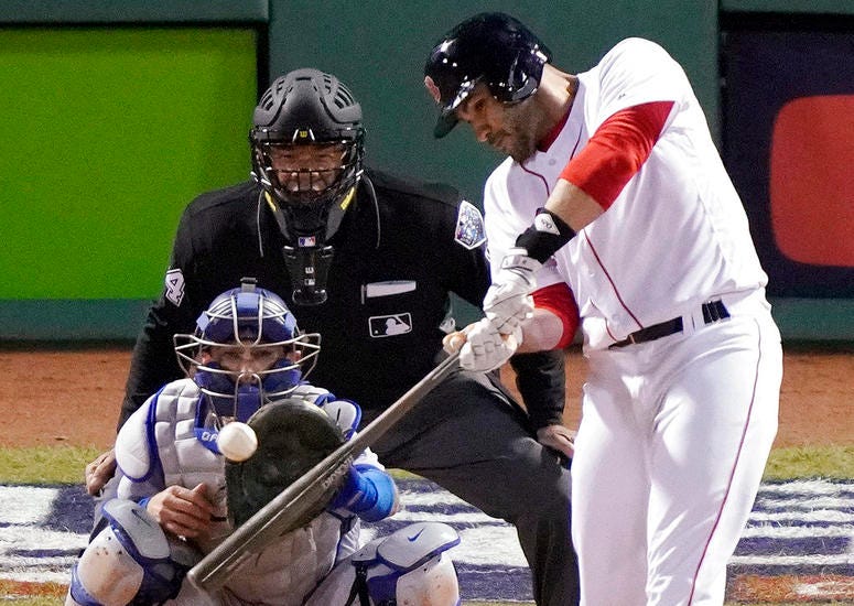 Boston Red Sox designated hitter J.D. Martinez hits a single to drive in two runs against the Los Angeles Dodgers during the fifth inning in Game 2 of the World Series