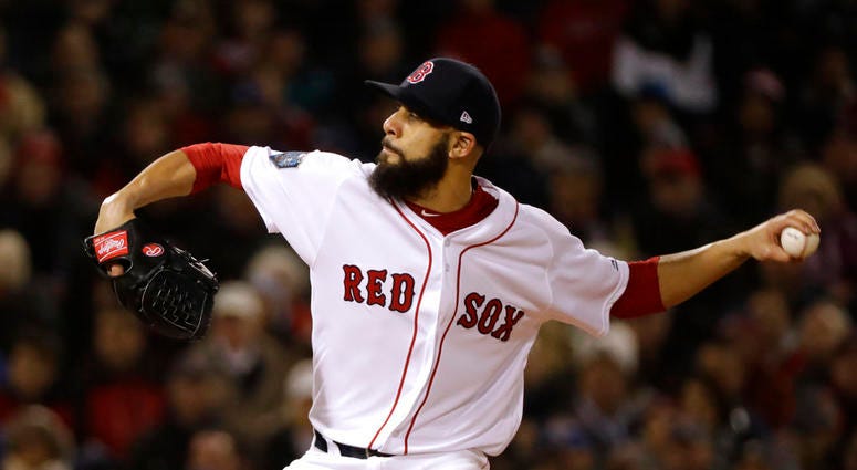Boston Red Sox's starting pitcher David Price winds up to throw during the first inning of Game 2 of the World Series
