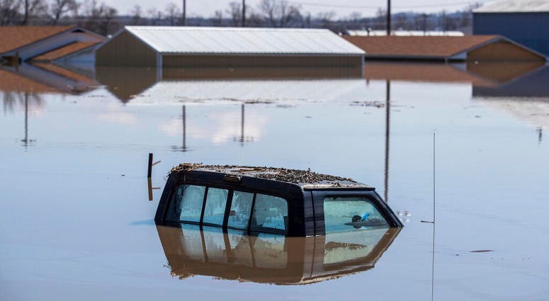 Chris Machian/Omaha World-Herald via AP