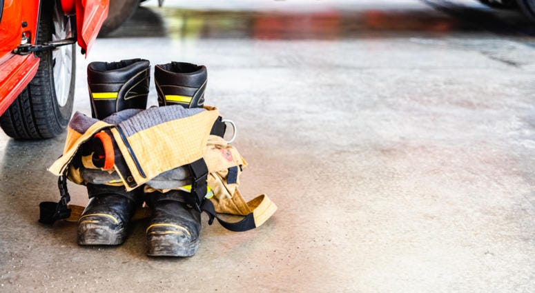 Flame retardant fireman's boots and pants ready to be used in case of emergency