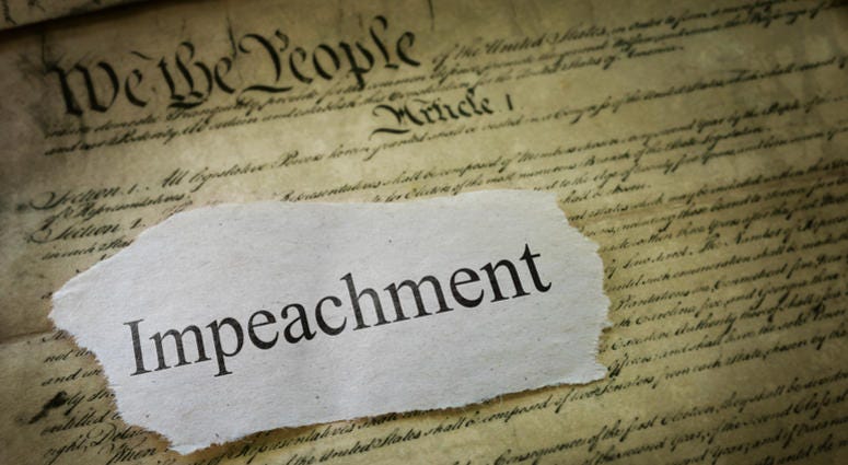 Illustration of the constitution with the word impeachment on it