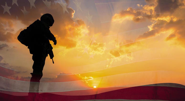 Double exposure Silhouette of Soldier on the United States flag in sunset for Veterans Day