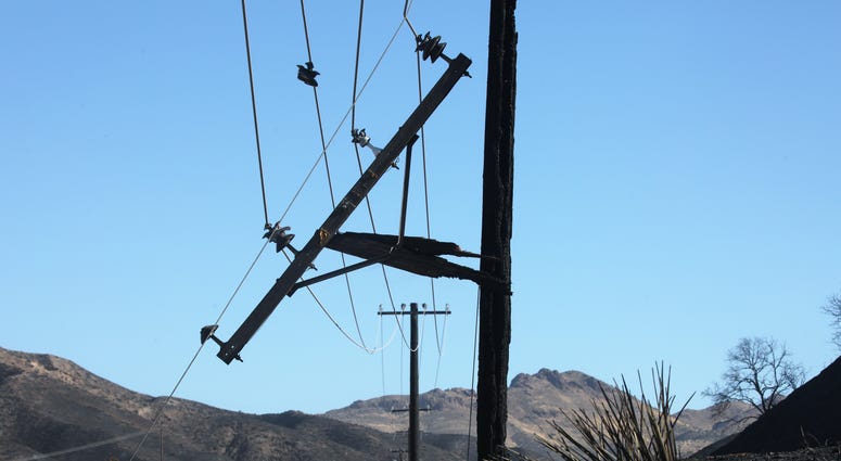 A utility pole stands burned by the Tick Fire on October 25, 2019 in Canyon Country, California.