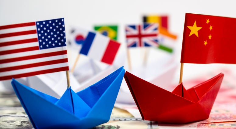 US America flag on blue ship and China flag on red ship
