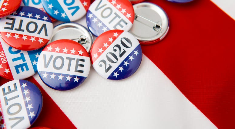 American vote badges on national USA flag background