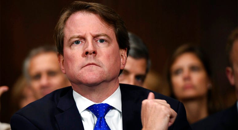 file photo, then-White House counsel Don McGahn listens as Supreme court nominee Brett Kavanaugh testifies before the Senate Judiciary Committee on Capitol Hill in Washington.