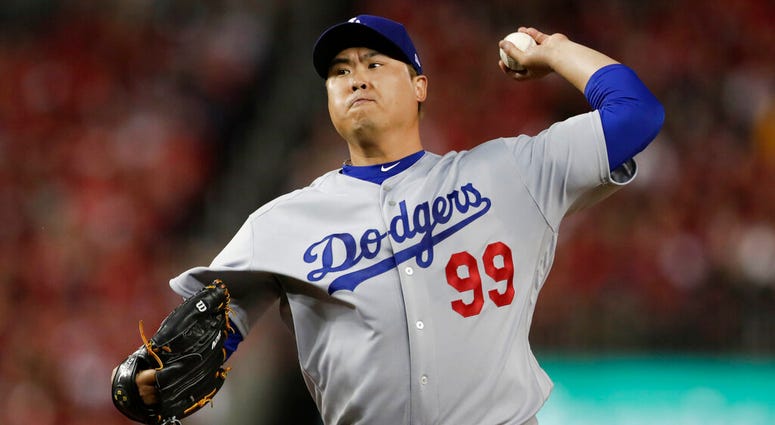 Los Angeles Dodgers starting pitcher Hyun-Jin Ryu throws to a Washington Nationals batter during the first inning in Game 3 of a baseball National League Division Series in Washington.