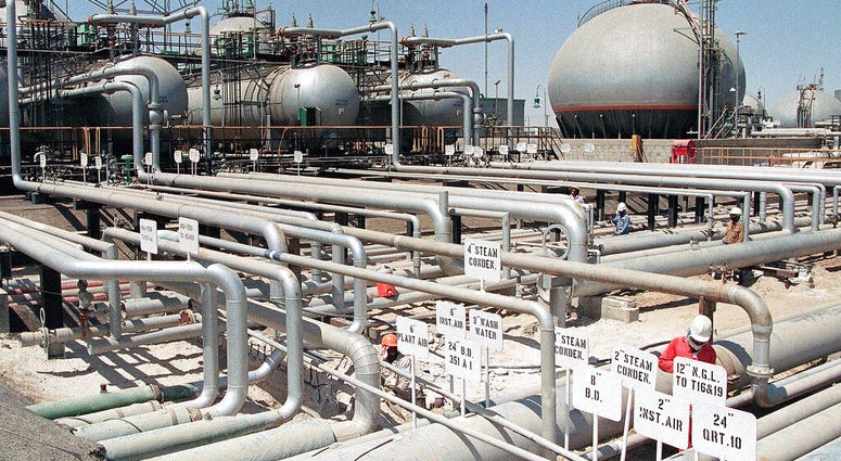 In this file photo dated 1990, Aramco refinery at Ras Tannura, Saudi Arabia. The price of oil surged Friday Jan. 3, 2020, as global investors were gripped with uncertainty over the potential repercussions and any retaliation, after the United States kille