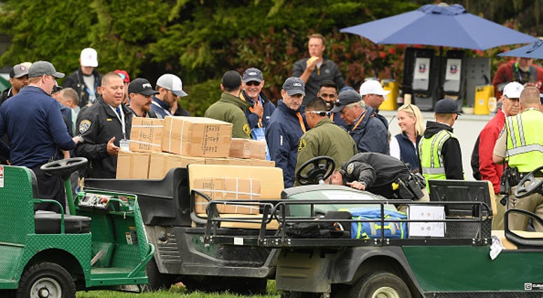 A golf cart loaded with boxes, which was involved an incident, is inspected on the 16th hole during the second round of the 2019 U.S. Open at Pebble Beach Golf Links on June 14, 2019 in Pebble Beach, California. (Photo by Ross Kinnaird/Getty Images) U.S. Open Golf Cart