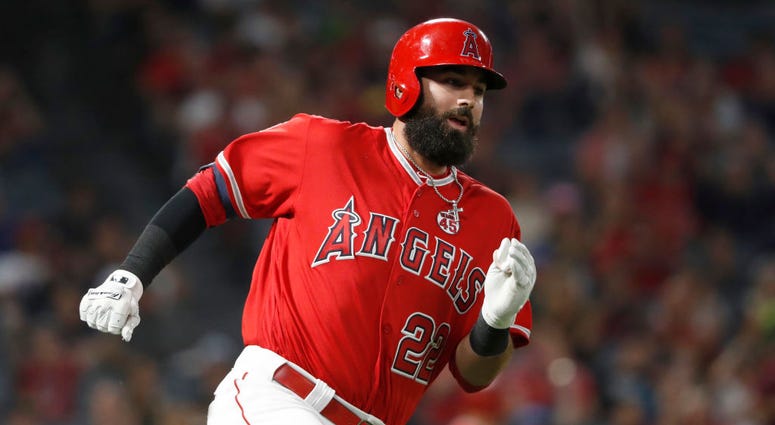 Kaleb Cowart #22 of the Los Angeles Angels of Anaheim runs to first base after hitting an RBI double during the seventh inning of a game against the Oakland Athletics at Angel Stadium of Anaheim on September 25, 2019 in Anaheim, California.