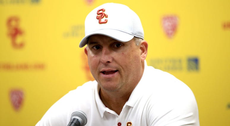 Head coach Clay Helton of the USC Trojans speaks to the media after defeating the UCLA Bruins 52-35 in a game at Los Angeles Memorial Coliseum on November 23, 2019 in Los Angeles, California.