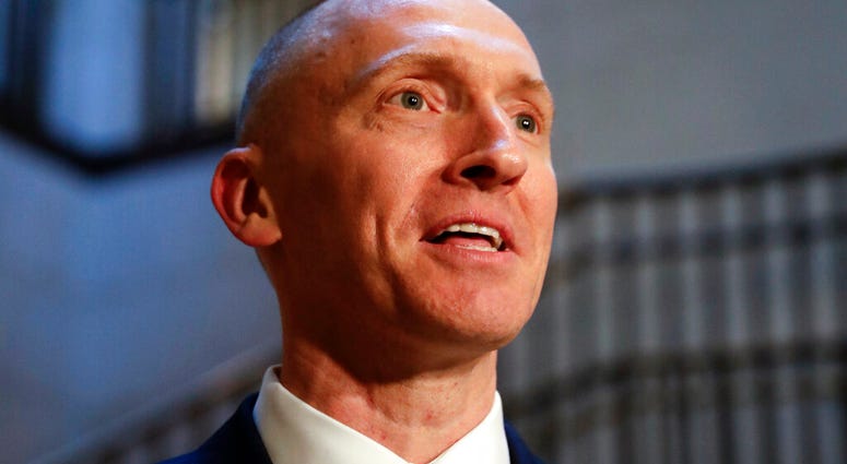 In this Nov. 2, 2017, photo, Carter Page, a foreign policy adviser to Donald Trump's 2016 presidential campaign, speaks with reporters following a day of questions from the House Intelligence Committee, on Capitol Hill in Washington.