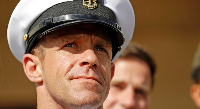 In this Tuesday, July 2, 2019, file photo, Navy Special Operations Chief Edward Gallagher leaves a military court on Naval Base San Diego.