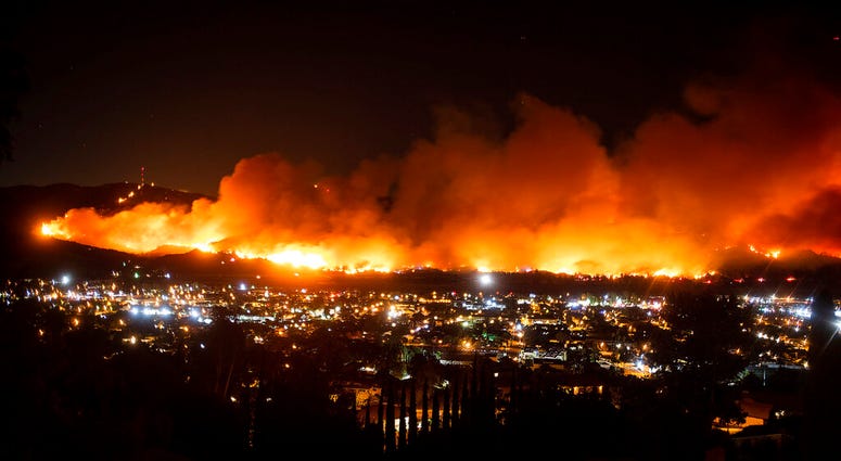 In this Oct. 31, 2019, file photo, smoke from the Maria Fire billows above Santa Paula, Calif.