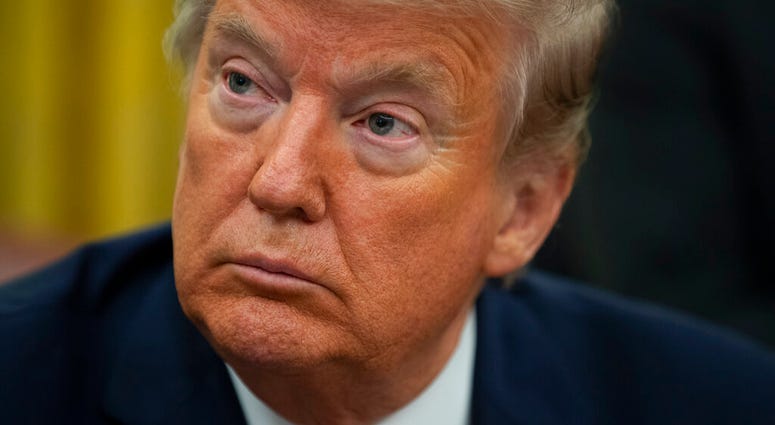 President Donald Trump listens during an event to sign an executive order establishing the Task Force on Missing and Murdered American Indians and Alaska Natives, in the Oval Office of the White House, Tuesday, Nov. 26, 2019, in Washington.