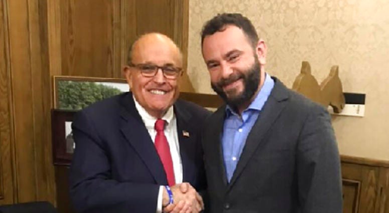 In this handout photo provided by Oleksandr Dubinsky's press office and taken on late Thursday, Dec. 5, 2019, Rudy Giuliani, an attorney for U.S President Donald Trump, left, meets with Ukrainian lawmaker Oleksandr Dubinsky in Kyiv, Ukraine.